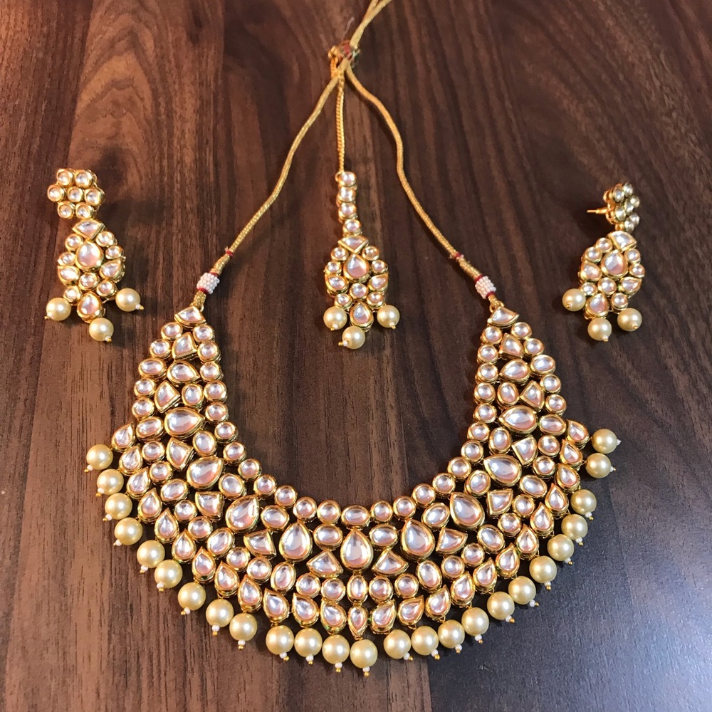 Beautiful polki neckpiece with earrings and maang tikka (forehead ornament)